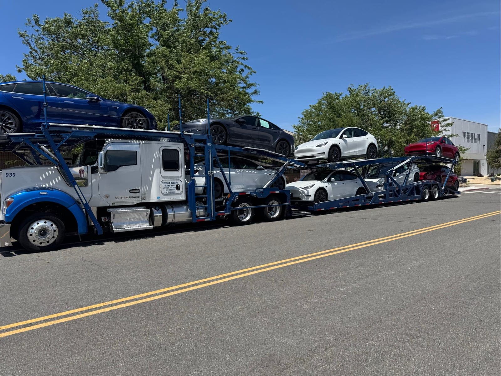 Great West Auto Kenworth car hauler loaded with vehicles