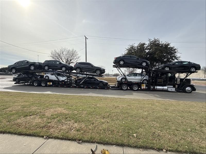 Great West Auto Cottrell car hauler loaded with vehicles