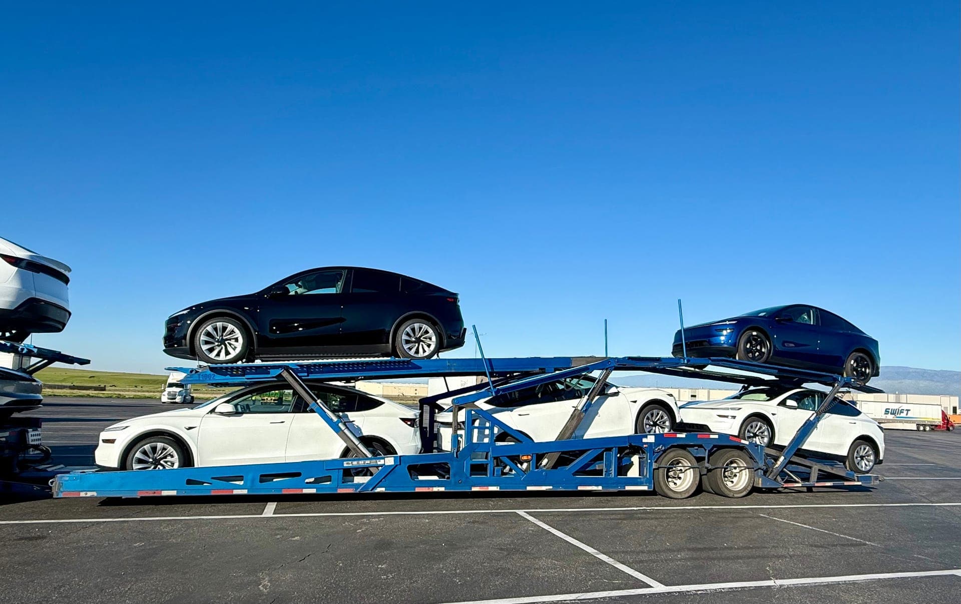 Great West Auto car hauler loaded with vehicles